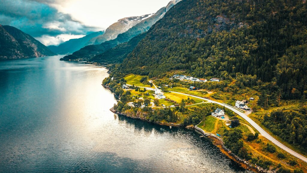 Landscape view of a curved road by a fjord in the Norwegian mountains