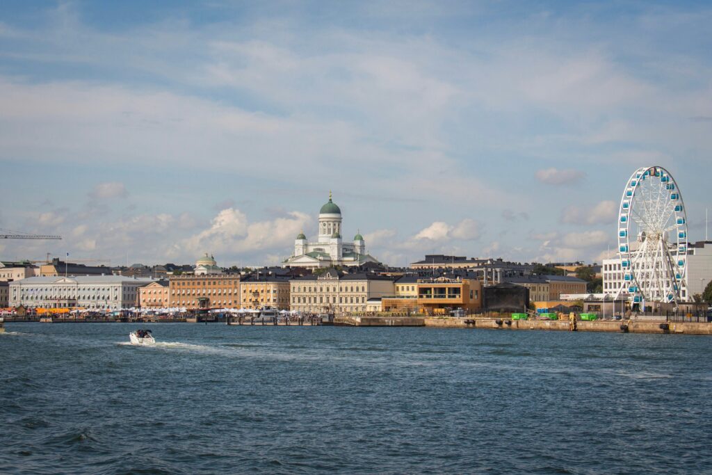Ferris wheel and buildings near water in Helsinki